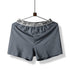 Gray boxer short with elastic waistband reading 'HELLO' displayed on hanger against white background