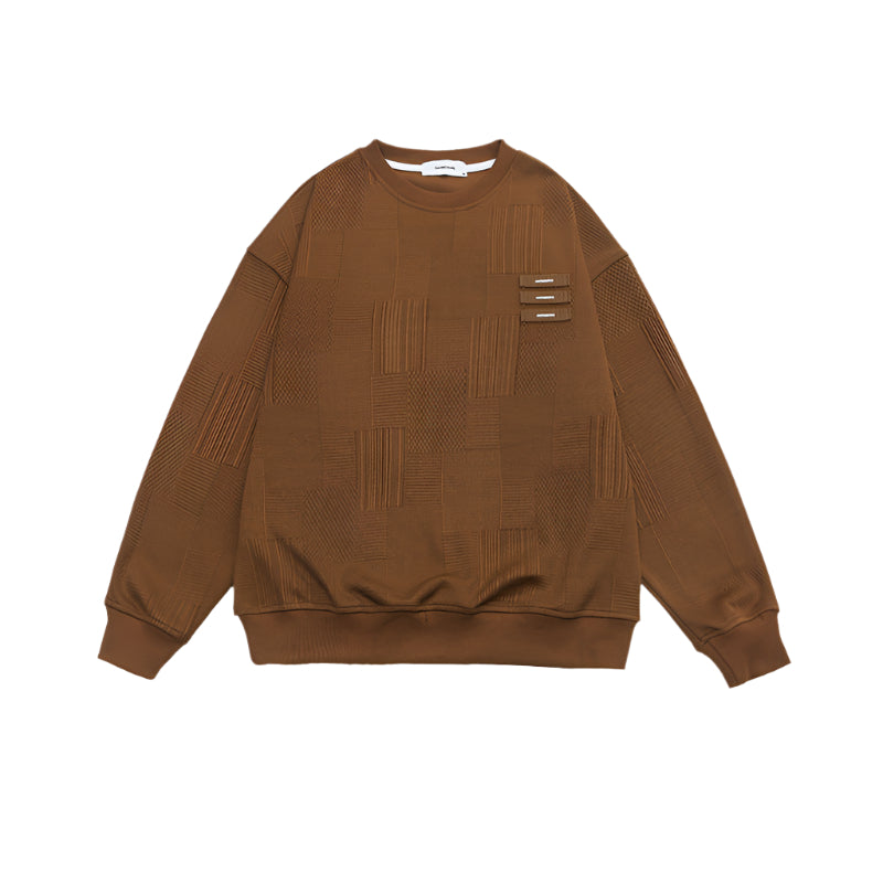 Front view of brown textured sweatshirt with geometric pattern and three decorative tabs
