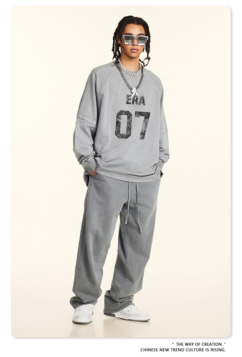 Full-length shot of model in gray 'ERA 07' loungewear set with white sneakers