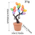 A tabletop Easter tree with pastel speckled eggs, rooted in a terracotta pot. Dimensions indicate 23cm in height and 7cm in width.