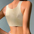 Beige seamless racerback bra with quilted pattern and high neckline, showing compression support