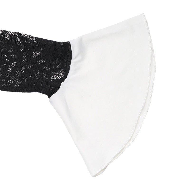 A close-up of the white flared sleeve cuff on a black lace dress, showcasing the layered contrast design.