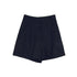 Navy blue linen shorts with front pleats and clean tailoring photographed against white backdrop