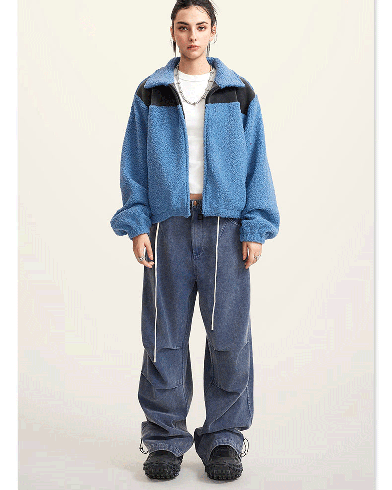 Blue fleece jacket with black color-block shoulders and full zip