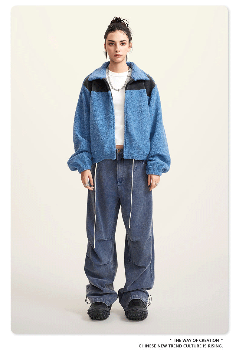Blue fleece jacket with black color-block shoulders and full zip