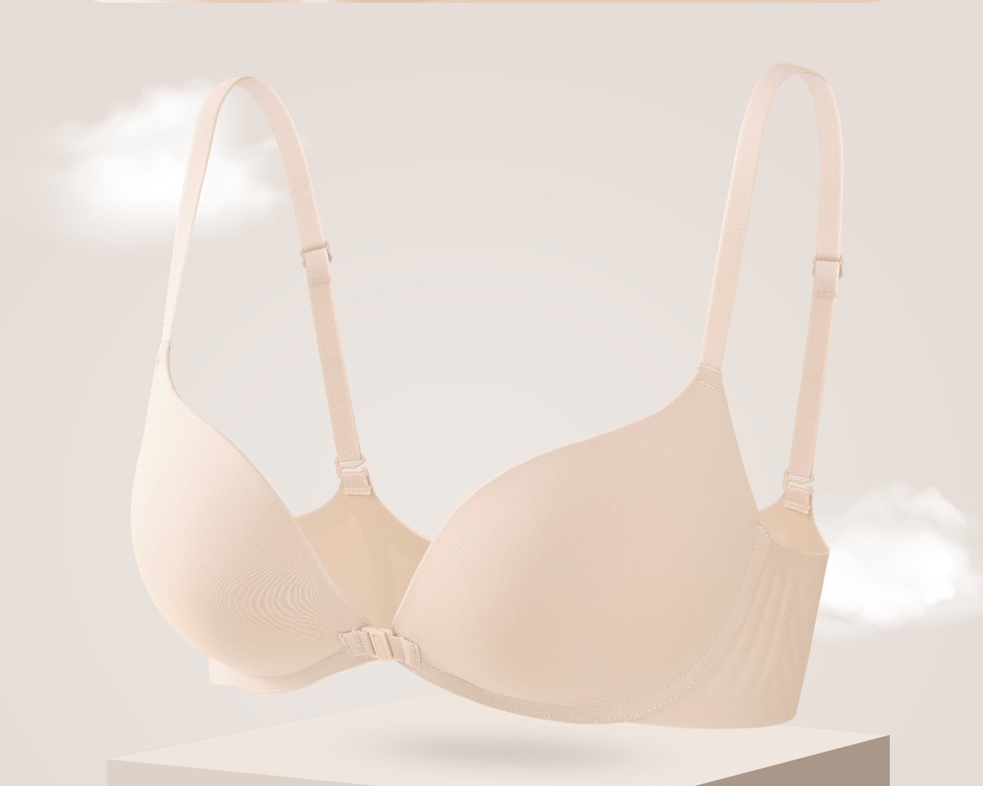 Medium nude seamless push-up bra with a front clasp, sculpting support, and smooth, soft fabric.