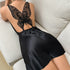 Black satin mini dress with sheer black butterfly lace back