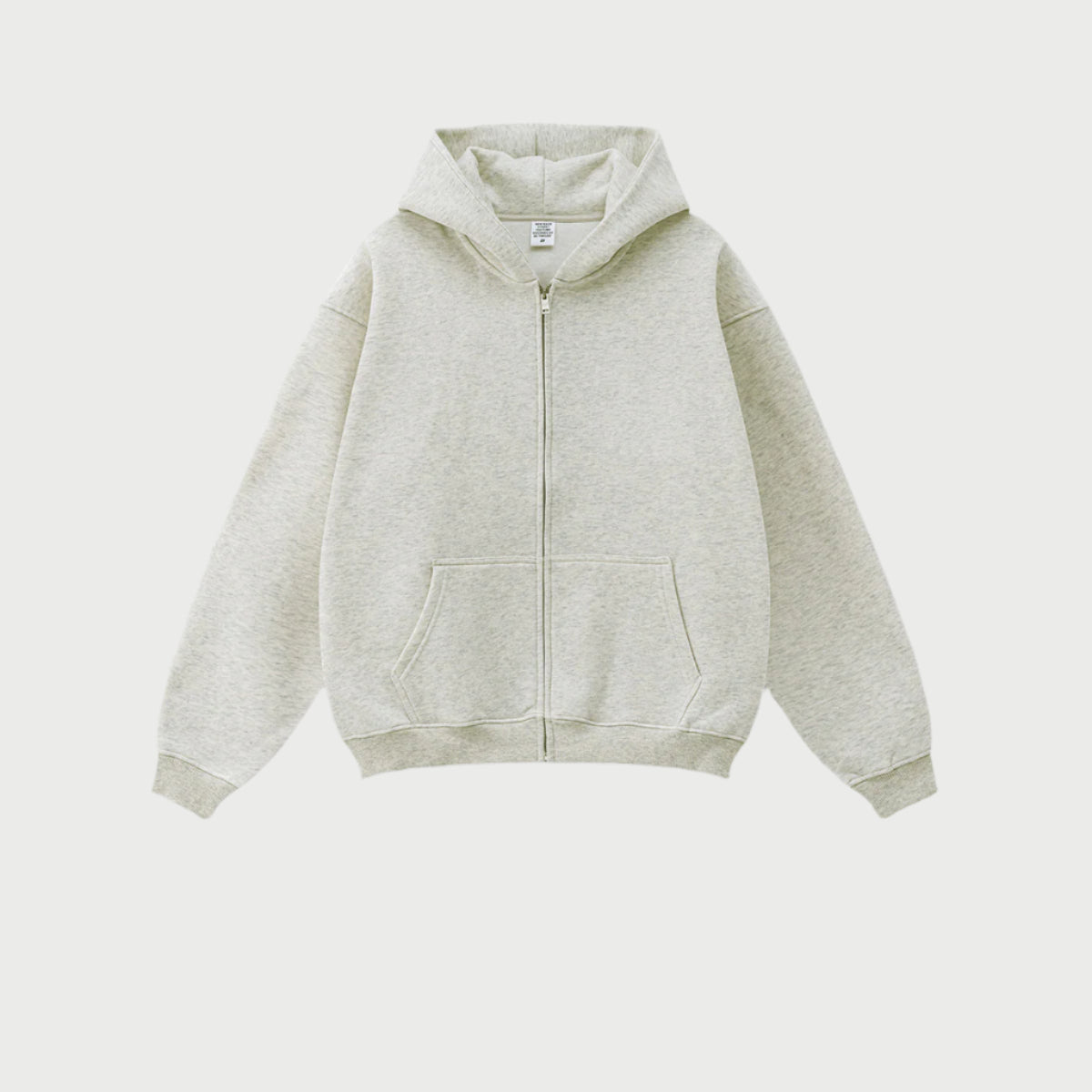 Light heather gray oversized zip-up hoodie with front kangaroo pocket and ribbed cuffs displayed on light gray background