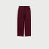 Burgundy sweatpants with elastic waistband, drawstring and side pockets displayed on light gray background