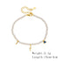 Product display of adjustable pearl bracelet with gold-plated lightning and heart charms, with measurements shown.