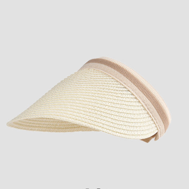 A chic white straw visor with a beige trim, designed for breathable sun protection while keeping your hair up.