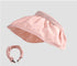 A soft pink sun visor hat with a ruched detachable headband, featuring a wide-brim design for sun protection.