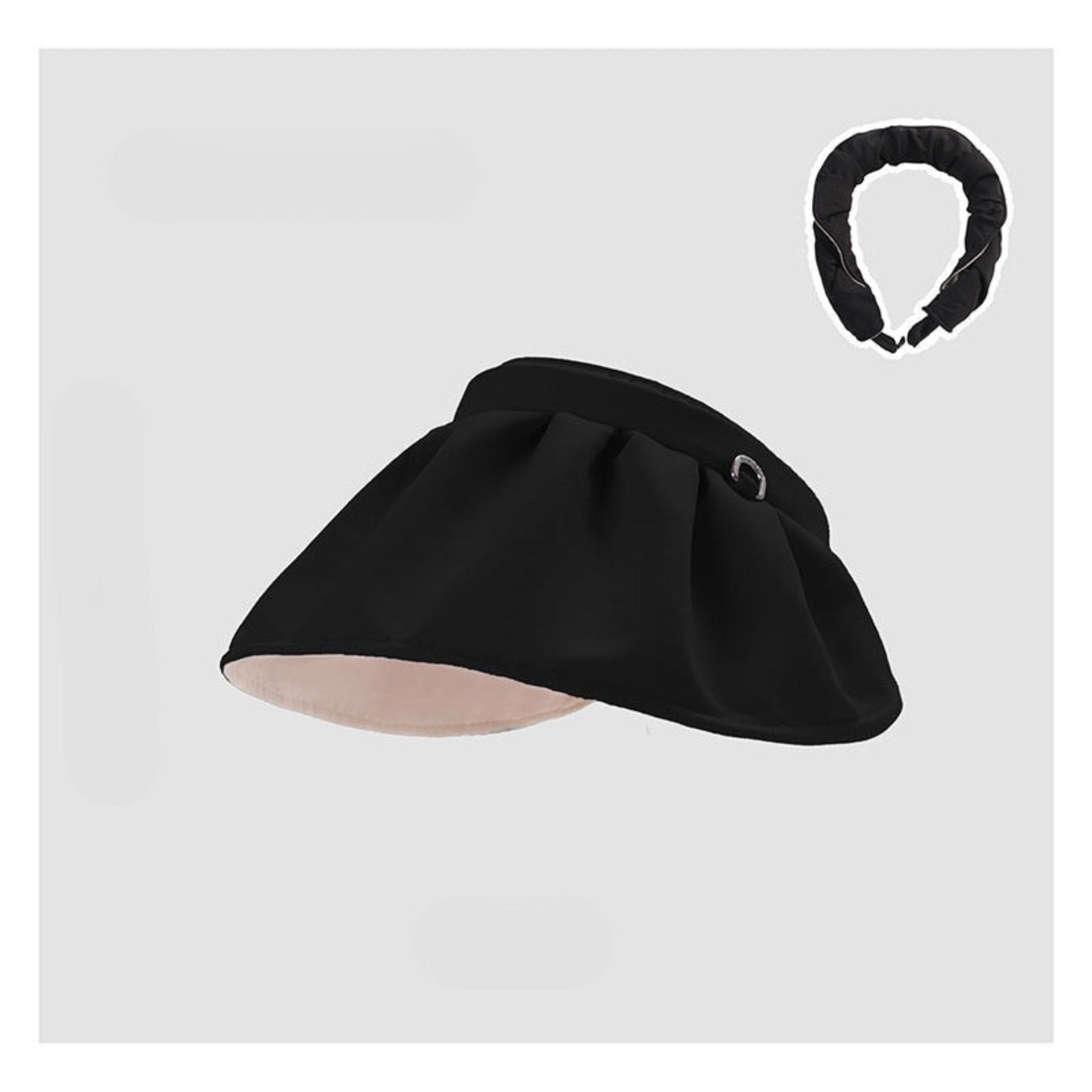 A bold black shell hat with a reversible design, featuring a ruched headband for added texture and comfort.