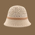 A beige straw bucket hat with a light brown stripe and an open-weave pattern on top, blending style and sun protection.