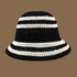 A black crochet bucket hat with white stripes, featuring a chic, monochrome design that pairs effortlessly with any outfit.