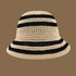 A beige crochet bucket hat with black stripes, designed with a soft brim and an airy woven pattern for a relaxed summer vibe.