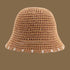 A khaki-colored straw bucket hat with a breathable open-weave design and white-trimmed brim, perfect for beach outings.