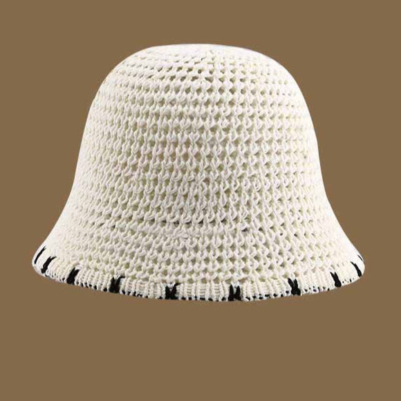 A white crochet-style straw bucket hat with a black-trimmed brim, offering a lightweight and chic sun protection option.