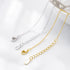Close-up of silver and gold lobster clasps and extension chains marked “925”.
