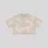 Beige cropped t-shirt with crew neck and short sleeves displayed flat against light gray background