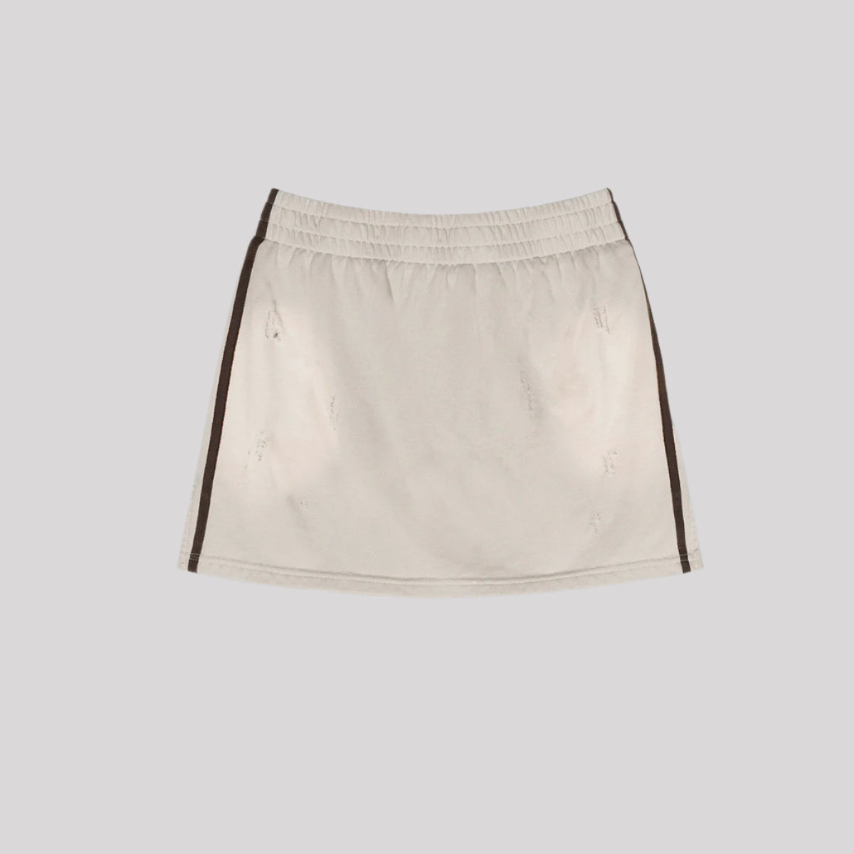 Beige mini skirt with elastic waistband and black side stripes displayed flat against light gray background