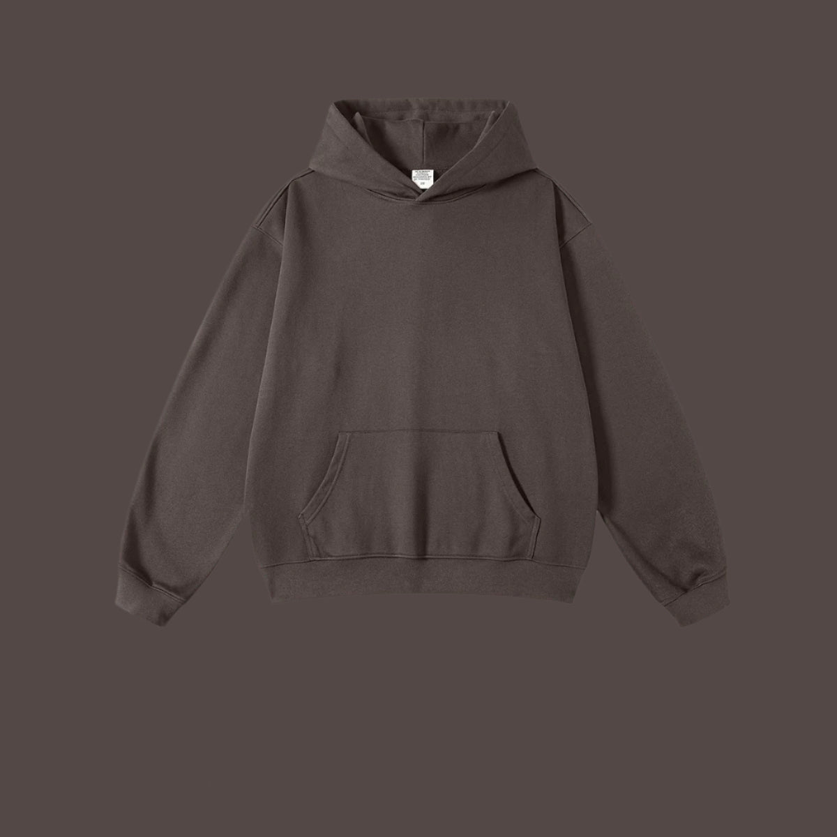 Dark gray hoodie with front kangaroo pocket and ribbed cuffs on dark background
