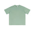 Mint green oversized t-shirt with crewneck design, short sleeves and relaxed fit, displaying tag at collar and smooth cotton fabric texture