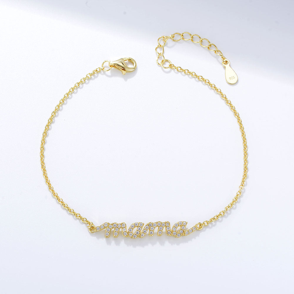 Gold bracelet with pavé MAMA charm and adjustable clasp.