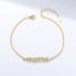 Gold bracelet with pavé MAMA charm and adjustable clasp.