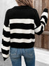Striped black and white collared sweater paired with jeans and gold necklaces