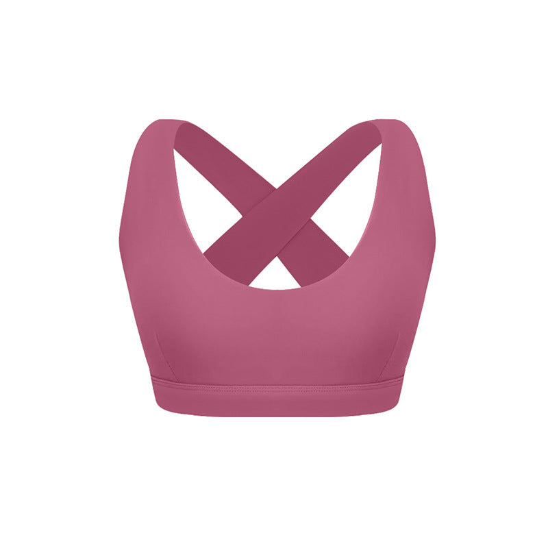 Wild rose pink sports bra with crossed back straps and scoop neckline