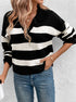 Striped black and white collared sweater paired with jeans and gold necklaces