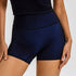 Navy blue workout shorts with high-rise waistband and contrast stitching, shown against white backdrop