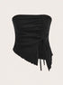 A black strapless bandeau top with side ruching and asymmetric hem with adjustable drawstring detail against white background
