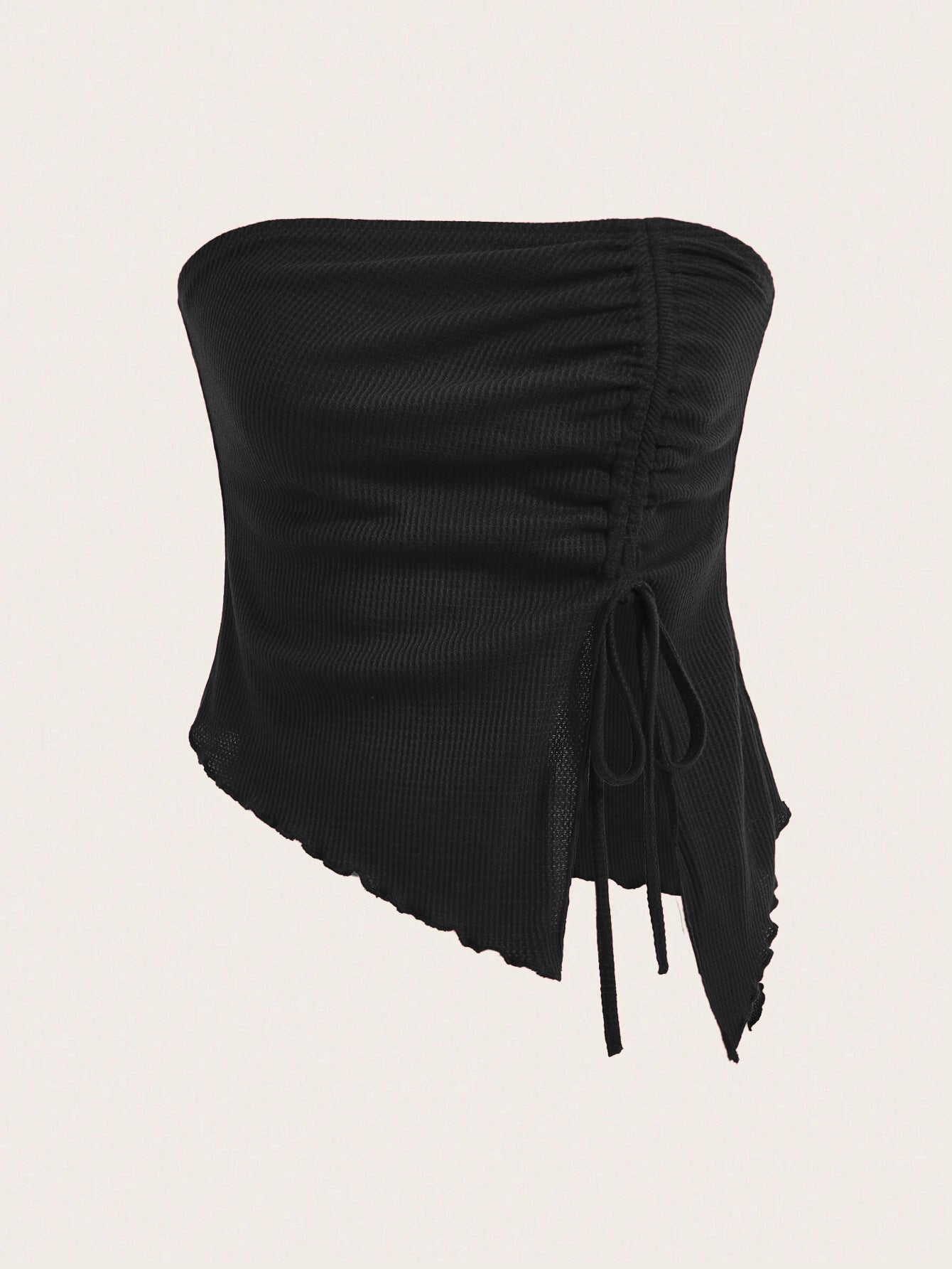 A black strapless bandeau top with side ruching and asymmetric hem with adjustable drawstring detail against white background