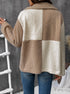 Two-tone beige and cream sherpa jacket with button front over white tank top and jeans