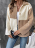 Two-tone beige and cream sherpa jacket with button front over white tank top and jeans