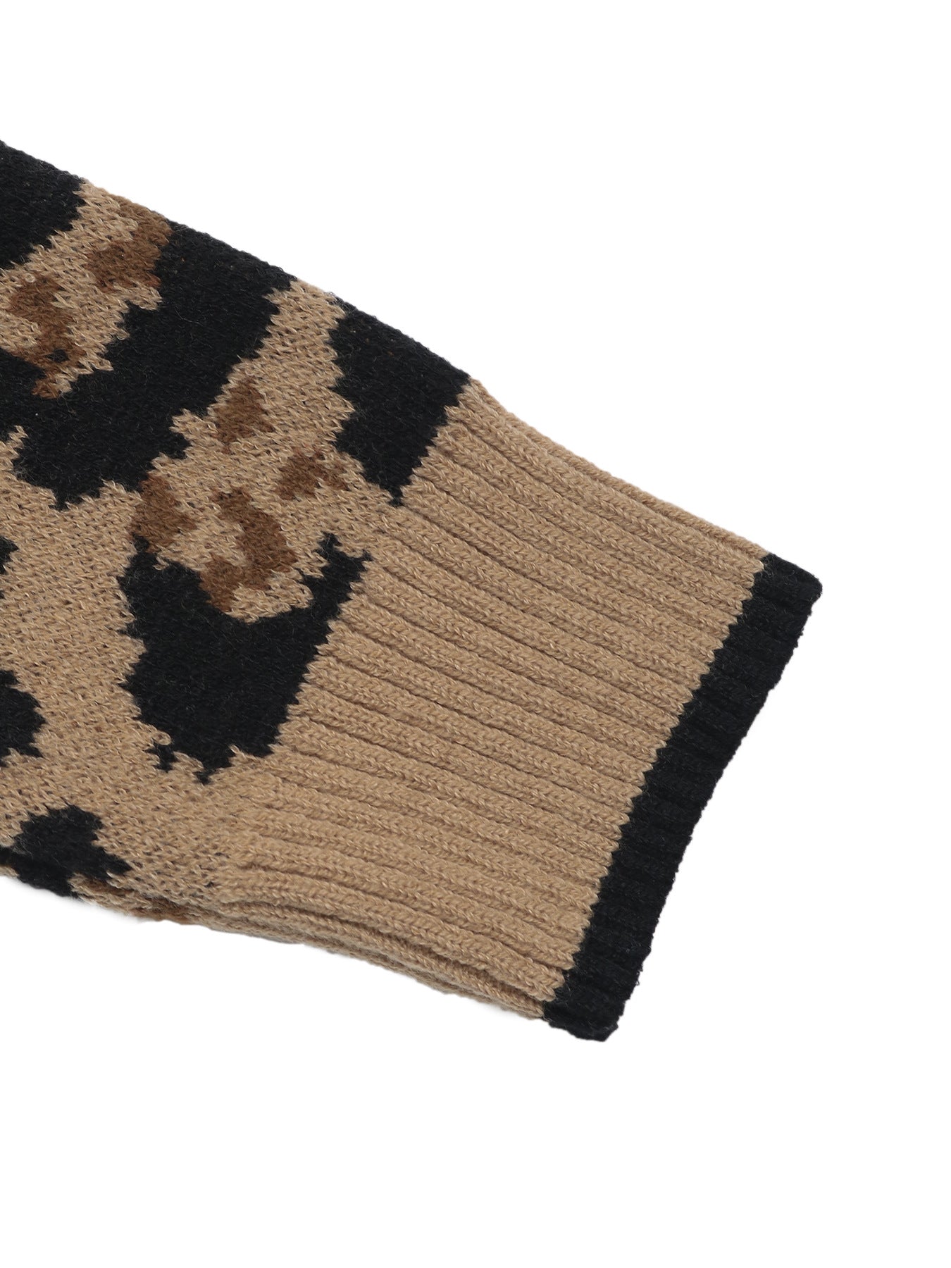 Detail shot of leopard print cardigan sleeve showing ribbed cuff with black trim