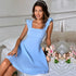 Light blue dress with ruffle straps and square neckline, styled with pearl headband and pink roses