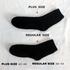 Black crew sock labeled as "Plus Size" in comparison to regular size, demonstrating size variation