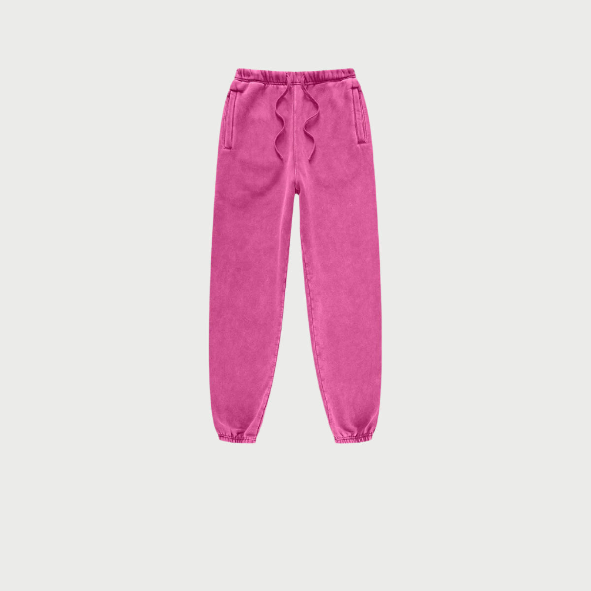 Pink jogger sweatpants with elastic waistband and side pockets displayed against white background