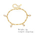 Product shot of gold pearl charm bracelet with weight and length specifications shown.