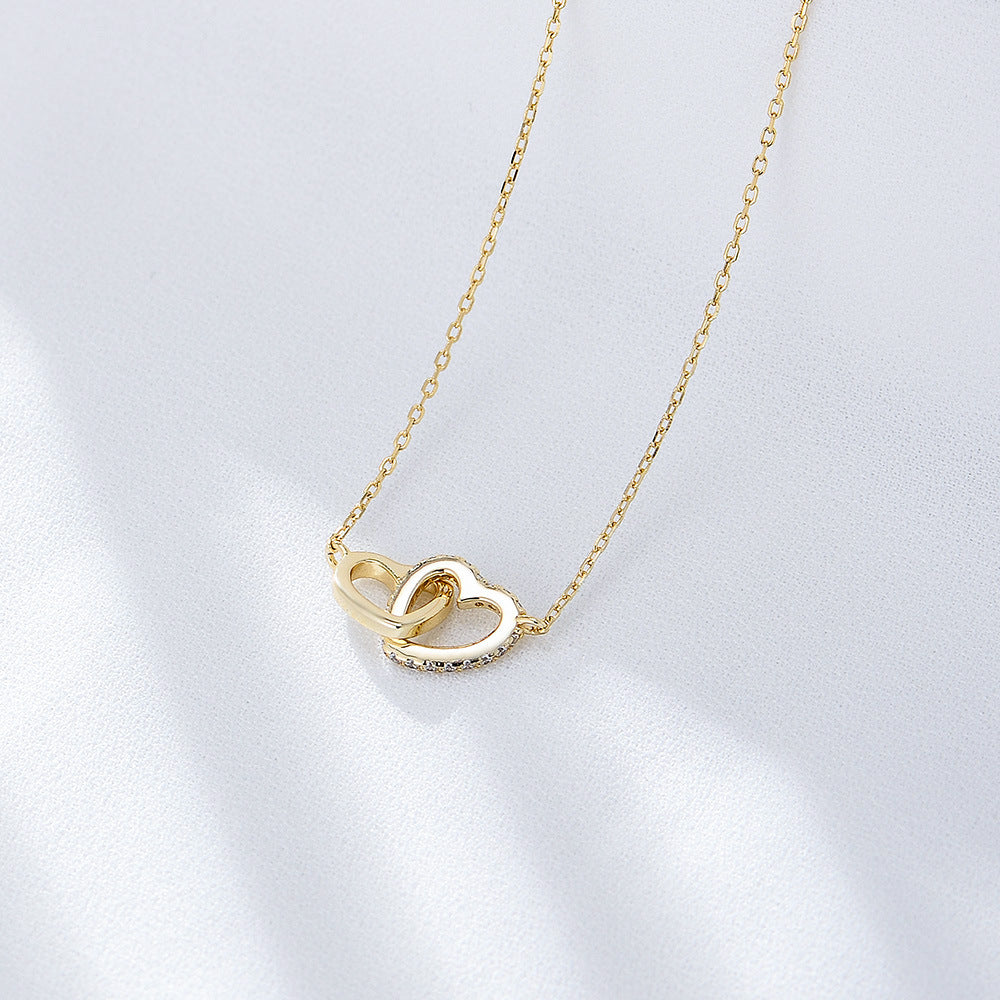 Gold-plated S925 sterling silver double heart necklace with cubic zirconia accents.