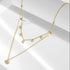 Gold layered CZ choker necklace with pavé disc pendant on white background.