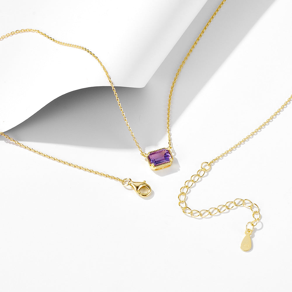 Gold-plated sterling silver necklace showing amethyst pendant, clasp, and chain extender.