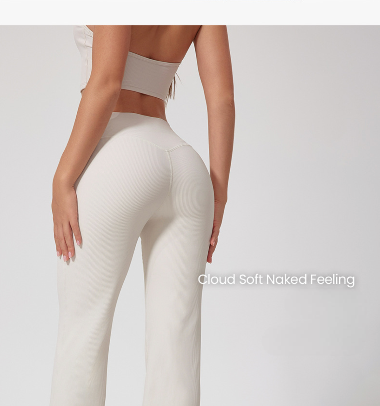 Back view of model in cream workout set, high-waist pants with 'Cloud Soft Naked Feeling' text overlay, seamless design, cream top.