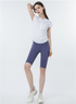 White short sleeve zip-up athletic tee with lavender biker shorts, casual sporty look with sneakers