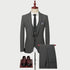 Gray three-piece suit with subtle plaid pattern on mannequin, paired with brown leather shoes and striped pocket square