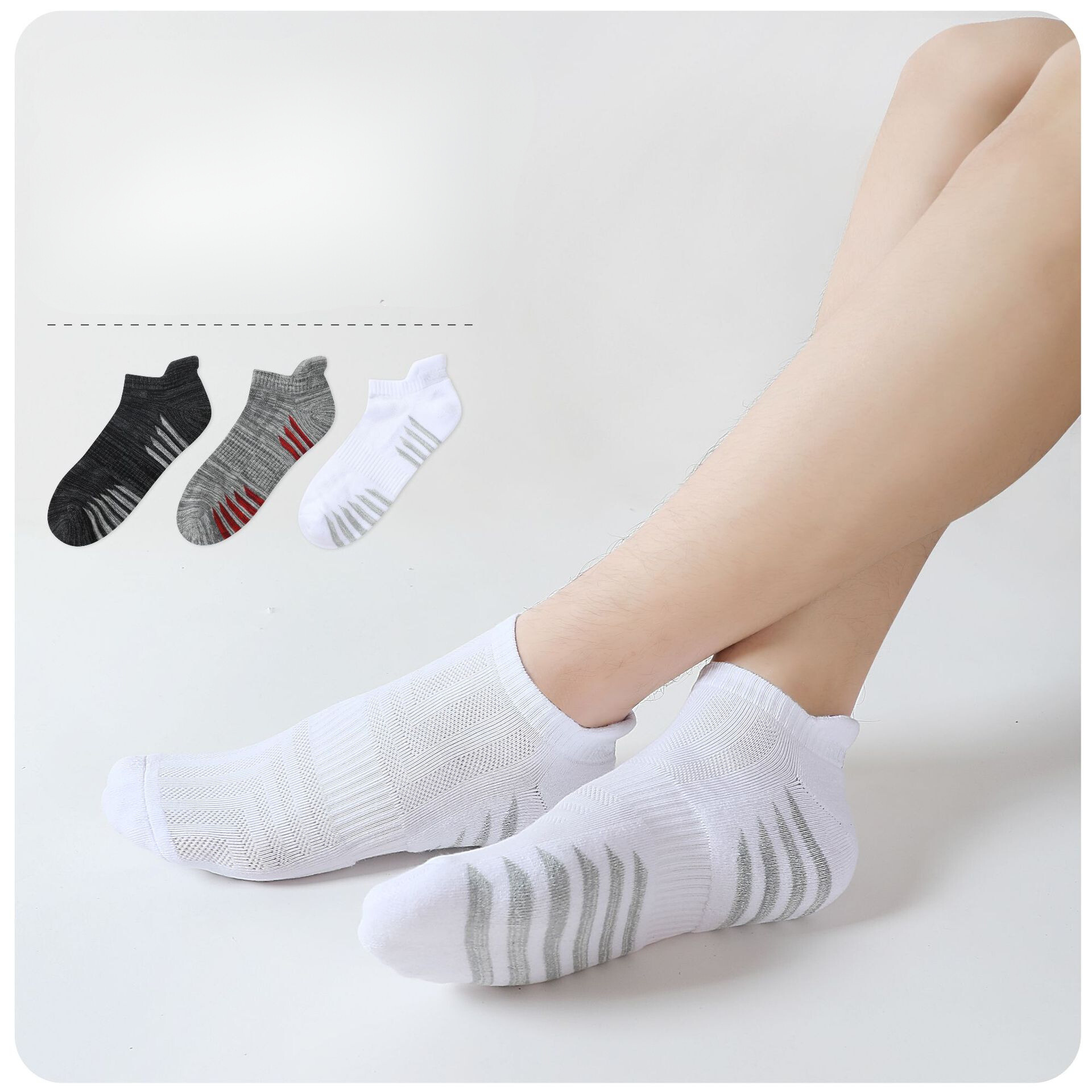 White mesh ankle socks with breathable ribbed texture and grey performance stripes, shown on model with arch compression