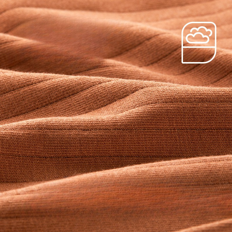 Close-up of camel ribbed fabric with cloud logo. Detailed texture view showing pinstriped pattern and knit construction